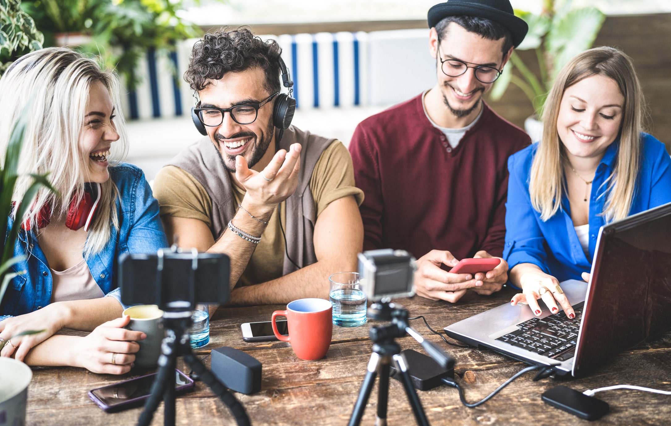 Young happy friends sharing content on streaming platform with digital web camera - Modern marketing concept with millenial guys and girls having fun vlogging live feeds on social media network influencer attribution
